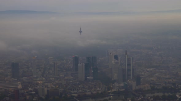 View to Frankfurt and its skyscrapers from flying airplane alt