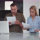 Serious Young Couple Pay Bills Online on Website App Doing Paperwork in Kitchen - VideoHive Item for Sale