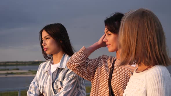 Beautiful Young Casual Women Waiting, Chatting and Lauging. alt