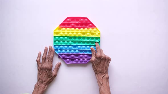 Senior Women Finger Simulation Exercise on Table Top View alt