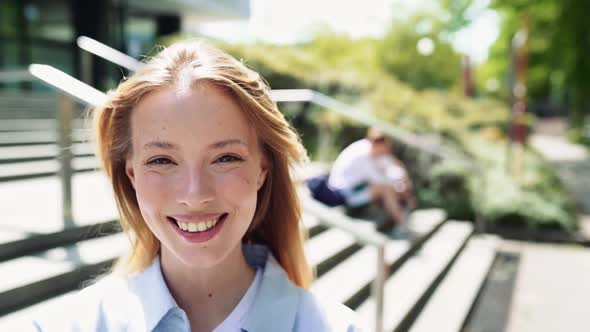 Smiling Pretty Girl University Student Looking at Camera Portrait Outdoors alt