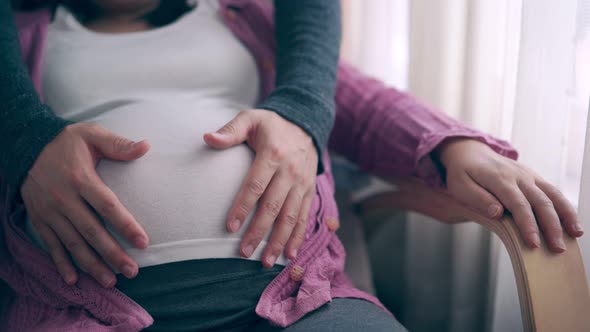 Pregnant Couple Feels Love and Relax at Home alt