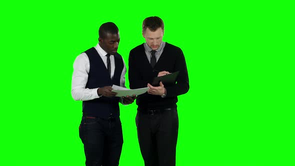 Businessmen Consider the Documents. Green Screen alt