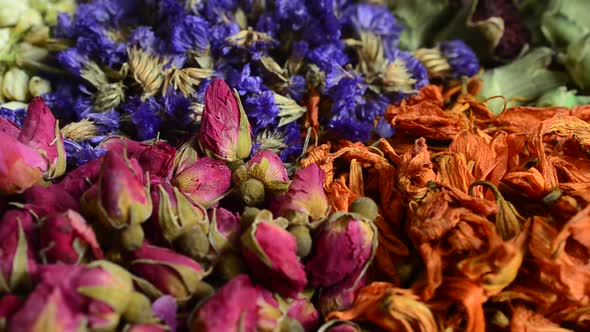Flower teas on a wooden board alt