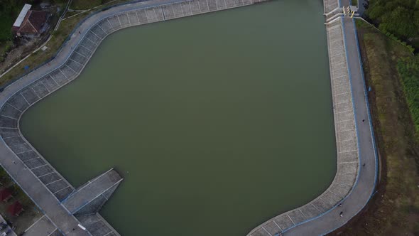 Aerial view of "Embung Imogiri" a reservoir with a puppet-like shape in Yogyakarta, Indonesia alt