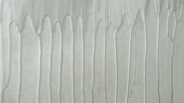 Silver Paint Background Color Tint Drops on Grey Wall Closeup alt