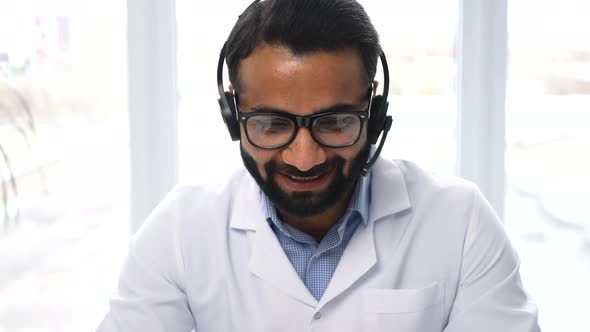 Indian Male Doctor Wearing White Medical Gown Involved Online Video Onference alt