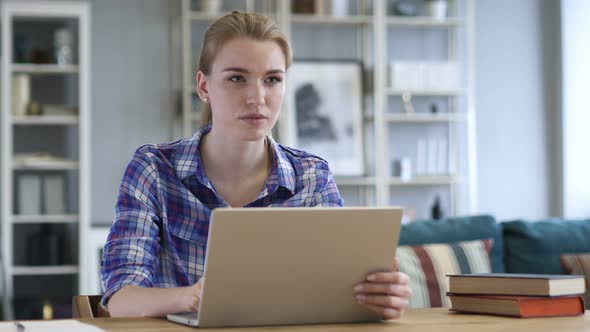 Young Woman Working On Laptop alt