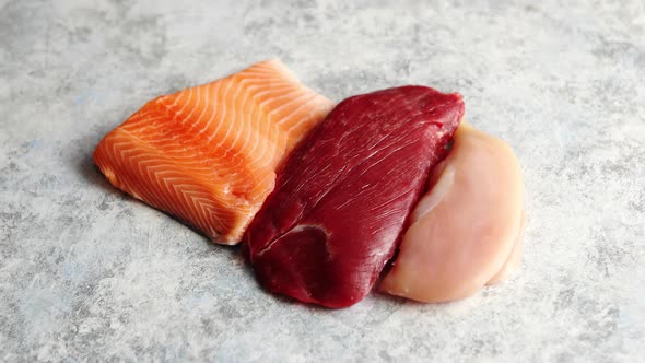 Fresh Raw Beef Steak, Chicken Breast, and Salmon Fillet alt