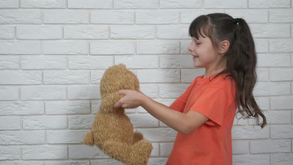 Dancing with teddy bear.  alt