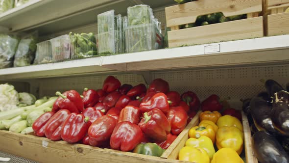 Large variety of vegetables and fruits on a supermarket shelves alt