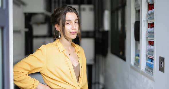 Woman Checking Bills for Elecricity at Home alt