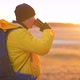 Hiker Young Tourist Enjoying Nature Drinking Hot Tea at Sunset - VideoHive Item for Sale