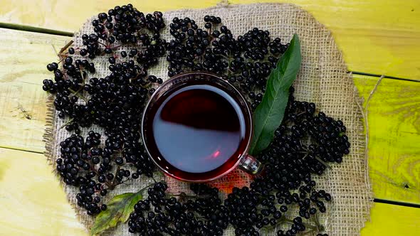 Red Black Berry Tea In A Cup Top View.Elderberry Tea. Vitamins With Natural Tea.