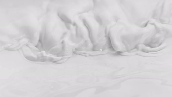 Super Slow Motion Shot of Waving Fresh Milk at 1000 Fps alt