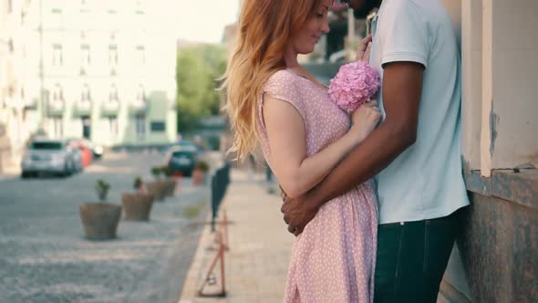 Young Couple in Love Standing and Tenderly Cuddling on Streets of European Cities alt