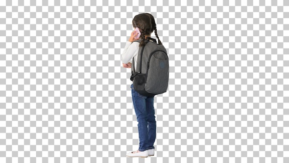 Smiling girl with backpack talking on, Alpha Channel alt
