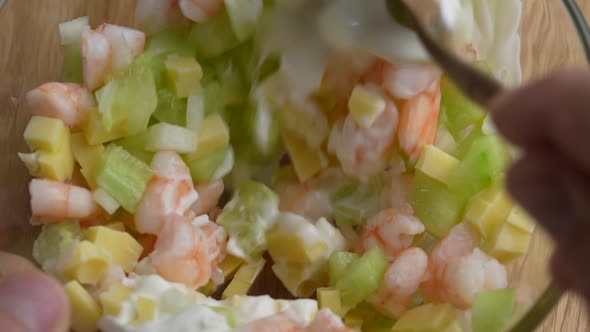Delicious shrimp salad of cucumber, cheese and onion alt