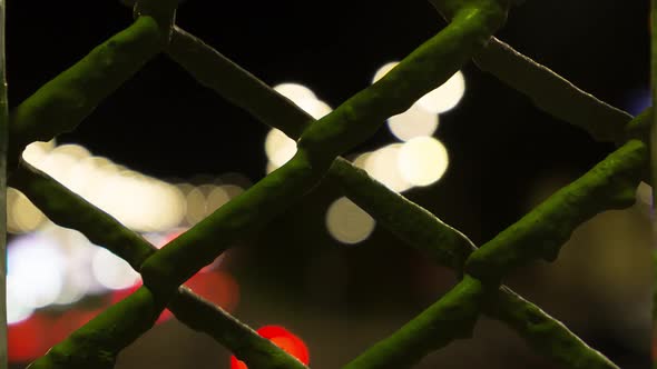 View Through The Bars At The Moving City Lights, Time Lapse
