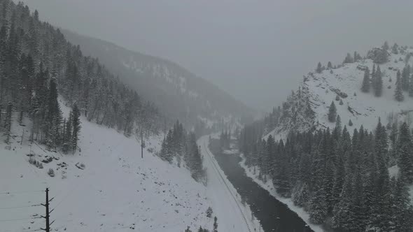 Snowfall on the River is in the Snow in the Air of Forest a Lot of Snowflakes alt