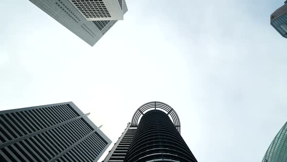 Time lapse of cloud moving pass over building skyscraper alt