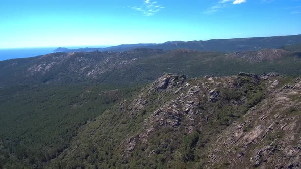 Aerial View Of Rocky Mountain Hillside In Esteiro, Spain. Dolly Back Establishing Shot alt