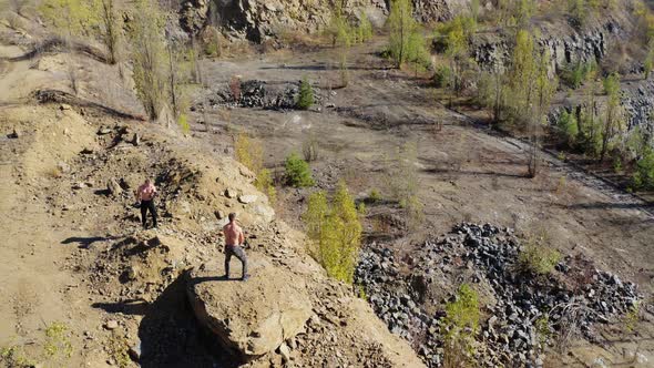 Young fit athlete working out. Handsome men dumbbells in hands outdoors alt