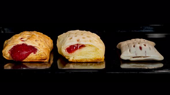 Timelapse Cinemagraph  Three Buns with Red Strawberry Jam Baking in Oven