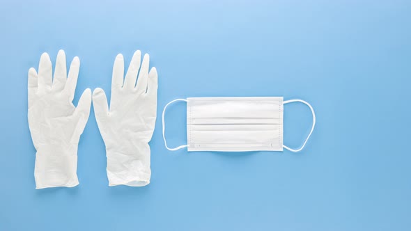 Personal protective equipment to protect and stay safe from Coronavirus on blue background