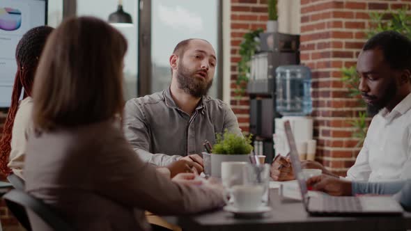 Close Up of Employee Meeting with Coworkers for Project Planning alt