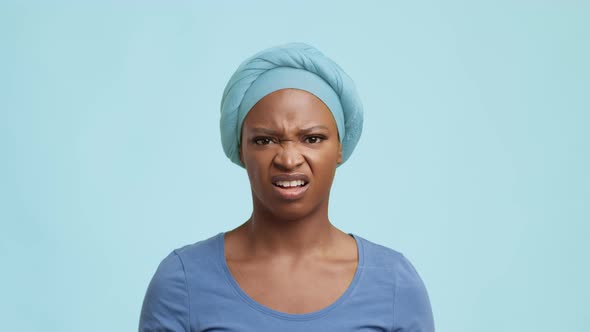 Displeased African American Woman Frowning Shaking Head Over Blue Background alt