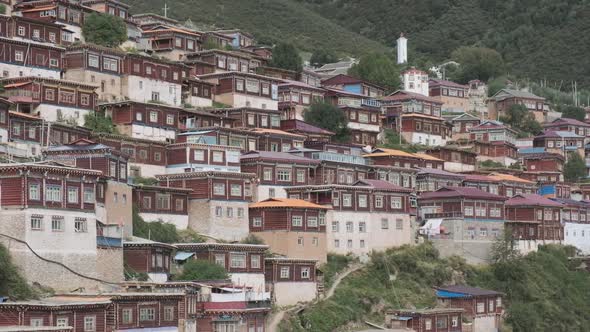 Wooden houses on foot of mountain alt