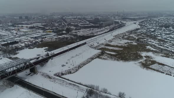 Aerial Video of a Moving Train on a cold winter day