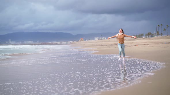 Smiling girl on the beach in California alt