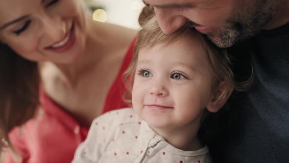Video of sweet little girl with parents on Christmas morning.  Shot with RED helium camera in 8K. alt