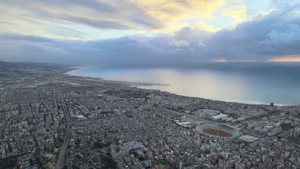 Drone Shot - Fly over Beirut showing Beirut Airport, southern suburbs, and Beirut Sports City