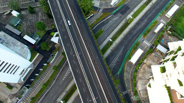 Aerial view of X cross Intersection city road look down view with car and vehicle movement