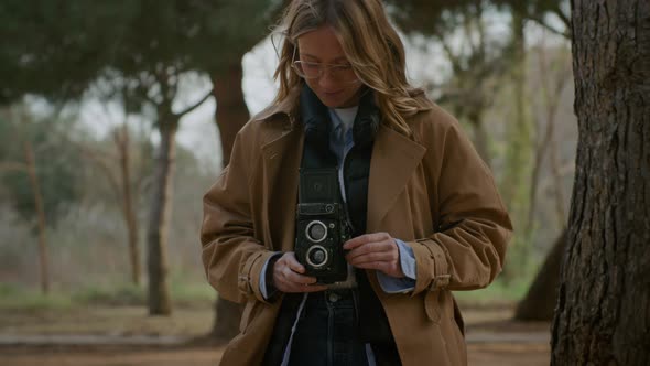 Female Photographer Holding Using Tlr Film Camera alt