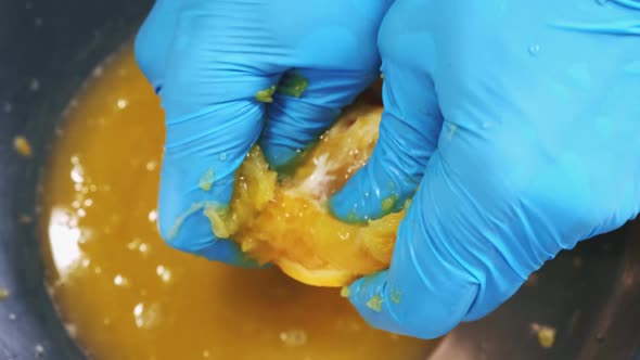 Chef Hands Top Down Squeeze Orange Juice Close Up alt
