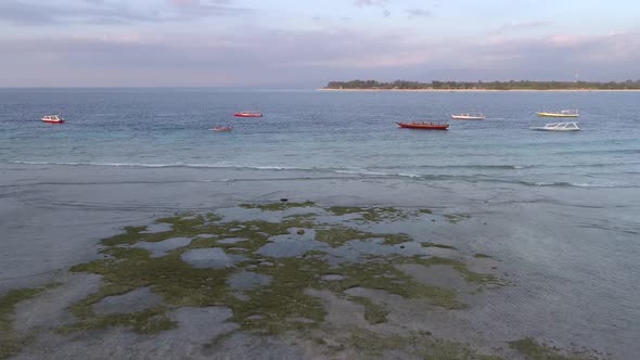 Aerial view at group of traditional boats anchored near coast, Indonesia. alt