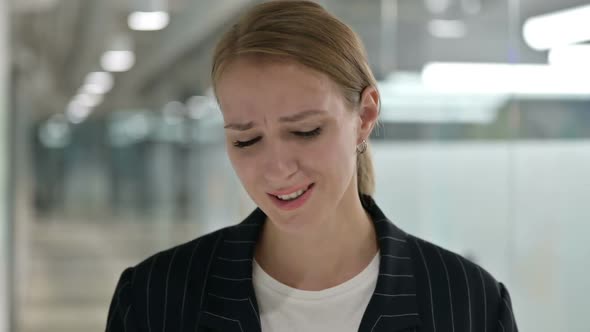 Young Businesswoman Reacting to Loss alt