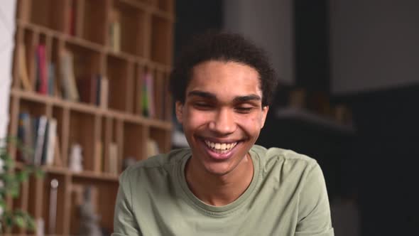 Headshot of a Cheerful Multiracial Guy at Virtual Meeting