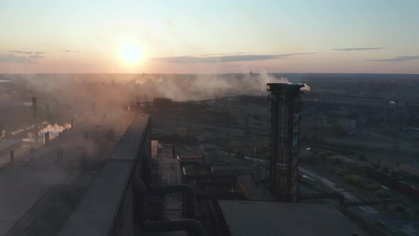 Aerial View. Industry Pipes Pollute the Atmosphere With Smoke alt