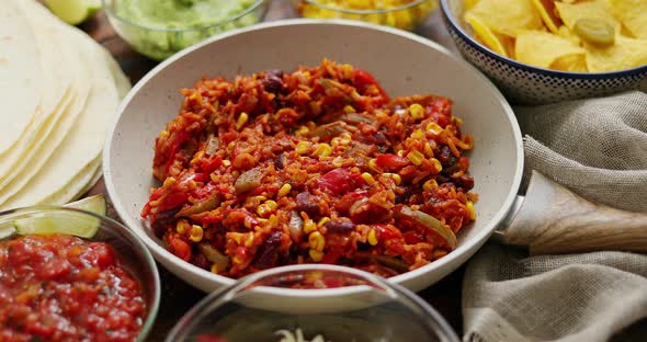 Preparing Vegetable Burritos on White Pan. With Various Ingredinets for Mexican Food alt