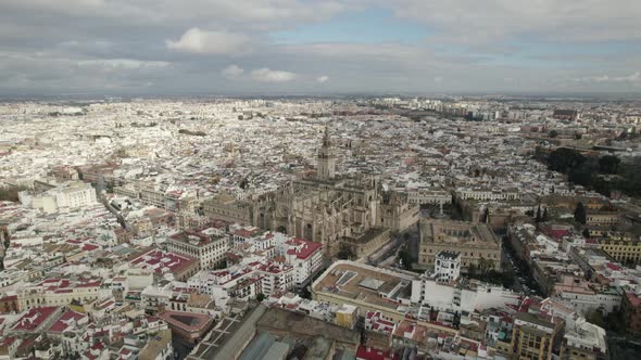 Aerial Orbiting view beautiful Seville cityscape with main attractions, Spain