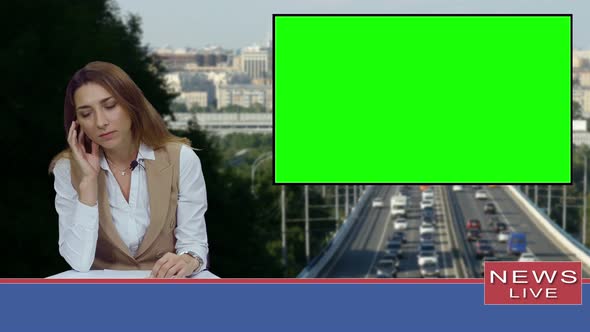 Female News Presenter in Broadcasting Studio With Green Screen Display For Mockup Usage