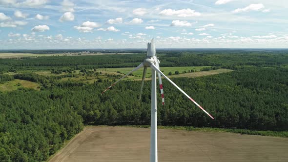 Wind Turbines With Damaged Blades Against Lush Vegetation In Wiatrak, Poland. Aerial Drone Shot alt