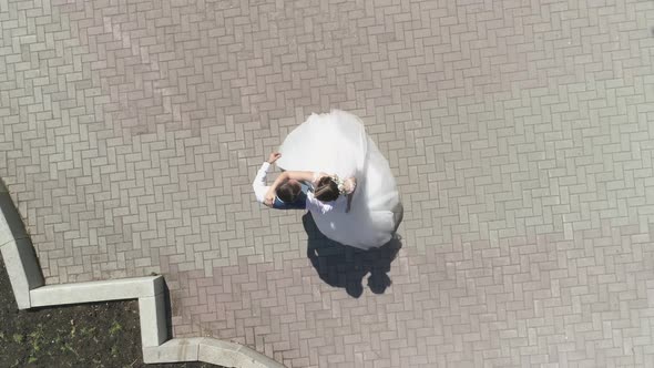 Aerial view of wedding couple dancing in a park 22 alt
