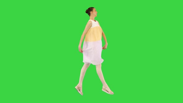 Young Beautiful Girl In Whiteyellow Dress Runs Seemingly Happy On A Green Screen Chroma Key By Funkeyrec