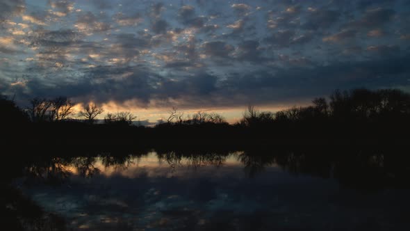 Brilliant Clouds Over Lake Before Sunrise Timelapse